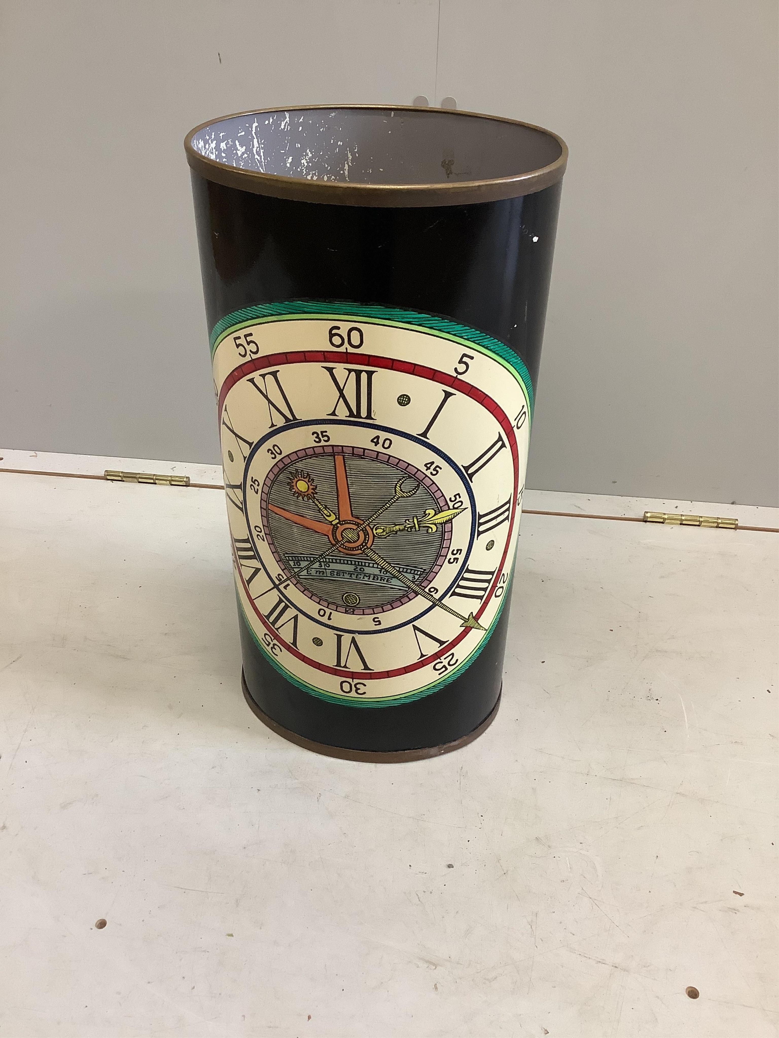 A Fornasetti 'clock dial' stick stand, width 25cm, depth 21cm, height 50cm